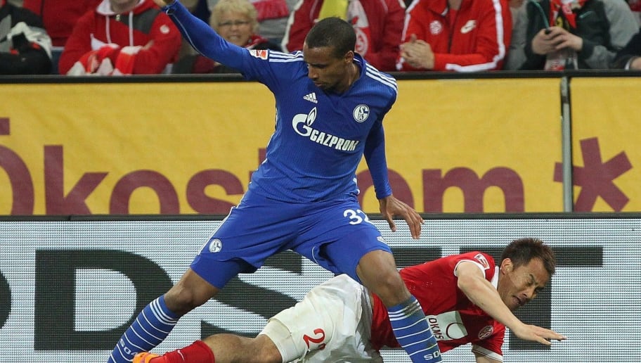 Schalke's Cameroonian defender Joel Matip (L) and Mainz' Japanese striker Shinji Okazaki vie for the ball during the German first division Bundesliga football match between 1 FSV Mainz 05 v FC Schalke 04 in Mainz, Germany, on April 24, 2015. Mainz won the match 2-0.  AFP PHOTO / DANIEL ROLAND

RESTRICTIONS - DFL RULES TO LIMIT THE ONLINE USAGE DURING MATCH TIME TO 15 PICTURES PER MATCH. IMAGE SEQUENCES TO SIMULATE VIDEO IS NOT ALLOWED AT ANY TIME. FOR FURTHER QUERIES PLEASE CONTACT DFL DIRECTLY AT + 49 69 650050.        (Photo credit should read DANIEL ROLAND/AFP/Getty Images)