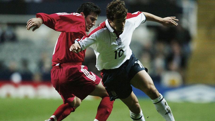 Ross Kinnaird/GettyImages NEWCASTLE - APRIL 1: Joe Cole of England takes the ball past Aslan Kemal of Turkey during the UEFA Under-21 Championships Group 7 Qualifying match between England Under-21's and Turkey Under-21's held on April 1, 2003 at St James' Park, in Newcastle, England. The match ended in a 1-1 draw. (Photo by Ross Kinnaird/Getty Images)