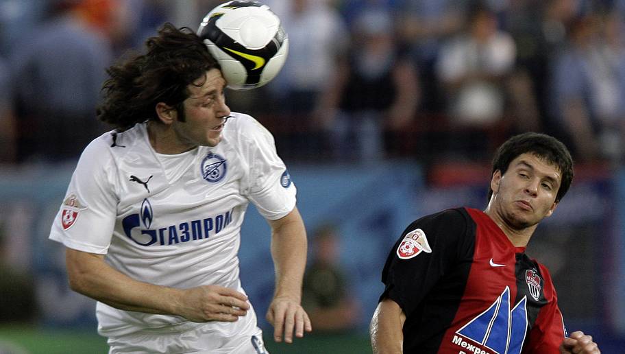 Dima Korotayev/GettyImages MOSCOW, RUSSIA - JULY 13: Oleg Dineev (R) of FC Khimki competes for the ball with Fatih Tekke of FC Zenit Saint Petersburg during the Russian Football League Championship match between FC Khimki and FC Zenit at the Rodina Stadium on July 13, 2008 in Khimki, outside Moscow,Russia. (Photo by Dima Korotayev/Epsilon/Getty Images)
