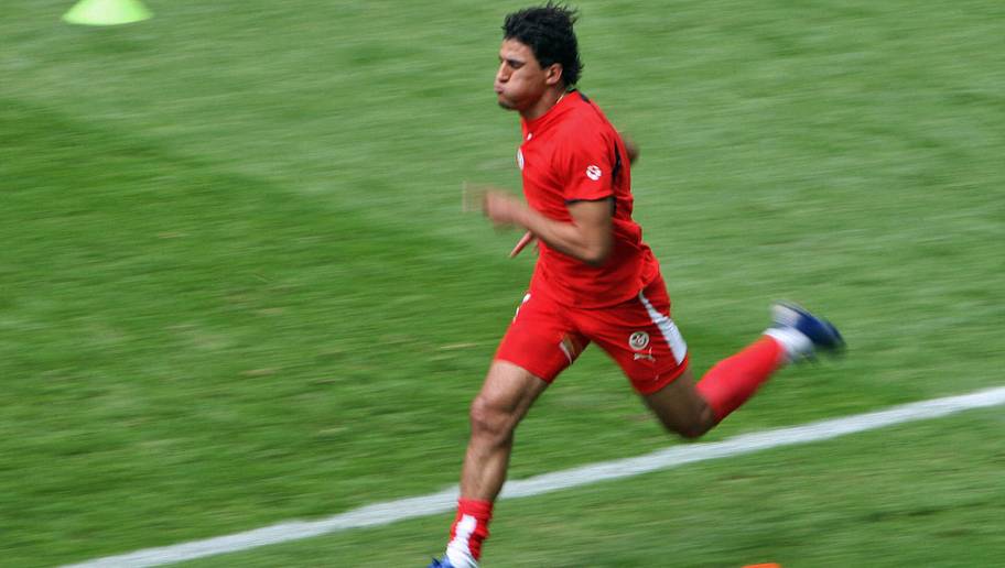 LOIC VENANCE/GettyImages Berlin, GERMANY: Tunisian midfielder Riadh Bouazizi warms up prior to the start of the opening round Group H World Cup football match Ukraine vs. Tunisia, 23 June 2006 in Berlin, Germany. AFP PHOTO / LOIC VENANCE (Photo credit should read LOIC VENANCE/AFP/Getty Images)