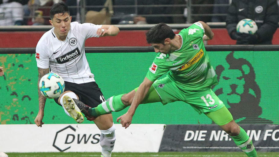 Frankfurt's Mexican defender Carlos Salcedo (L) and Moenchengladbach's German forward Lars Stindl vie for the ball during the German first division Bundesliga football match, Eintracht Frankfurt v Borussia Moenchengladbach on January 26, 2018 in Frankfurt am Main, western Germany. / AFP PHOTO / Daniel ROLAND / RESTRICTIONS: DURING MATCH TIME: DFL RULES TO LIMIT THE ONLINE USAGE TO 15 PICTURES PER MATCH AND FORBID IMAGE SEQUENCES TO SIMULATE VIDEO. == RESTRICTED TO EDITORIAL USE == FOR FURTHER QUERIES PLEASE CONTACT DFL DIRECTLY AT + 49 69 650050
 / RESTRICTIONS: DURING MATCH TIME: DFL RULES TO LIMIT THE ONLINE USAGE TO 15 PICTURES PER MATCH AND FORBID IMAGE SEQUENCES TO SIMULATE VIDEO. == RESTRICTED TO EDITORIAL USE == FOR FURTHER QUERIES PLEASE CONTACT DFL DIRECTLY AT + 49 69 650050        (Photo credit should read DANIEL ROLAND/AFP/Getty Images)
