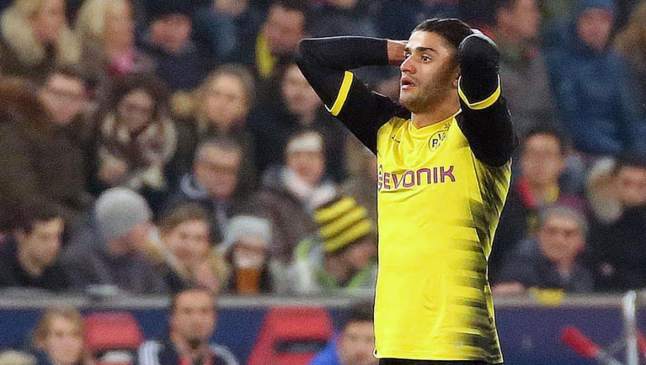 (L-R) Borussia Dortmund's Mahmoud Mo Dahoud reacts after the Europa League Round of 16 second leg football match between FC Salzburg and BV 09 Borussia Dortmund in Salzburg, Austria, on March 15, 2018.   / AFP PHOTO / APA / KRUGFOTO / Austria OUT        (Photo credit should read KRUGFOTO/AFP/Getty Images)