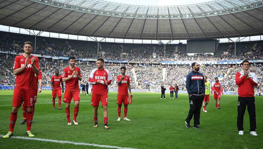 BERLIN, GERMANY - APRIL 14: Stefan Ruthenbeck, coach of Koeln, (2nd right) and players of Koeln applaud their supporters after the Bundesliga match between Hertha BSC and 1. FC Koeln at Olympiastadion on April 14, 2018 in Berlin, Germany. (Photo by Stuart Franklin/Bongarts/Getty Images)