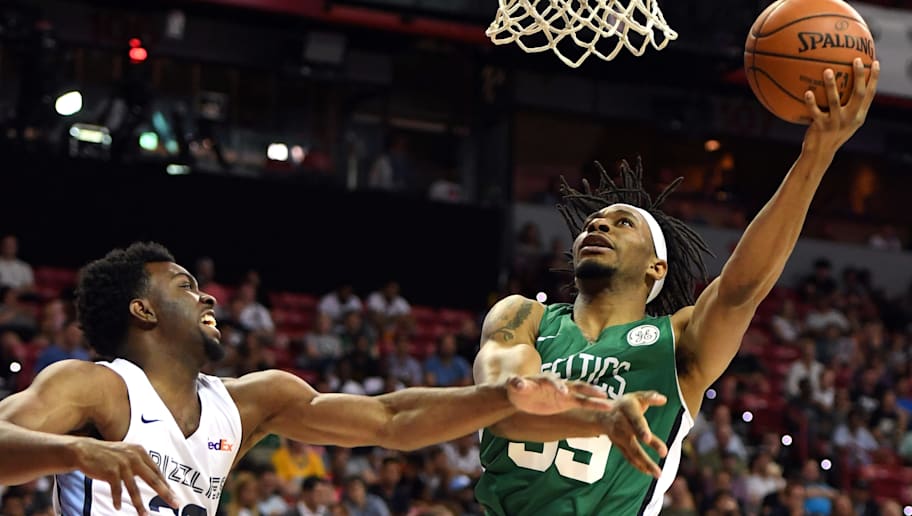 LAS VEGAS, NEVADA - JULY 11:  Stan Okoye #39 of the Boston Celtics shoots against Keenan Evans #36 of the Memphis Grizzlies during the 2019 NBA Summer League at the Thomas & Mack Center on July 11, 2019 in Las Vegas, Nevada. The Celtics defeated the Grizzlies 113-87. NOTE TO USER: User expressly acknowledges and agrees that, by downloading and or using this photograph, User is consenting to the terms and conditions of the Getty Images License Agreement.  (Photo by Ethan Miller/Getty Images)