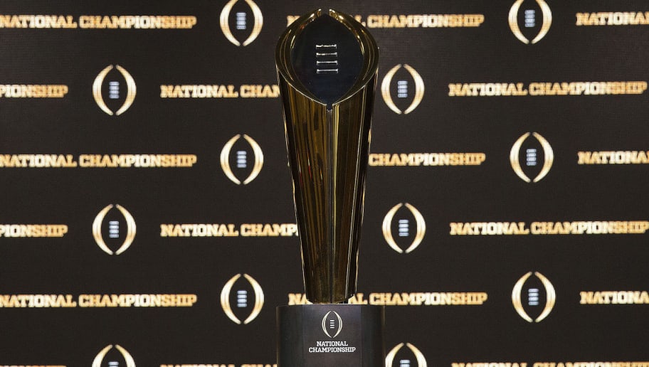 ATLANTA, GA - JANUARY 07:  Detail of the College Football Playoff National Championship trophy, along with the helmets of the 2 competing teams, University of Alabama (left) and University of Georgia (right) on January 7, 2018 in Atlanta, Georgia.  (Photo by Mike Zarrilli/Getty Images)