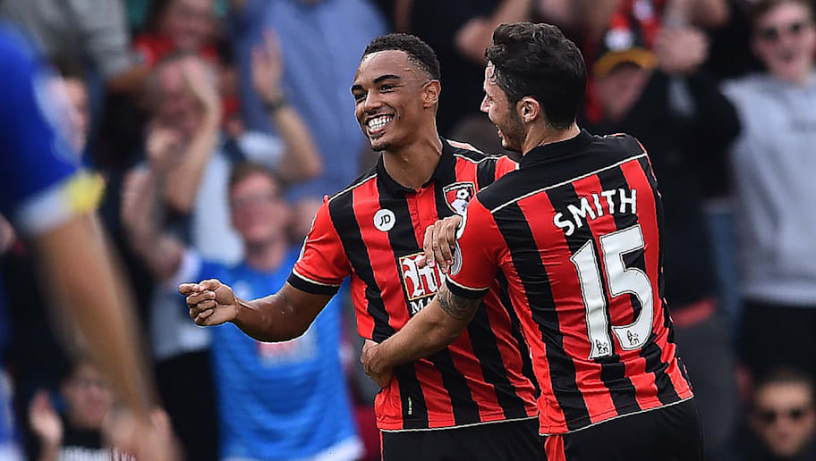 Bournemouth's English midfielder Junior Stanislas (L) celebrates with Bournemouth's English defender Adam Smith after scoring his team's first goal during the English Premier League football match between Bournemouth and Everton at the Vitality Stadium in Bournemouth, southern England on September 24, 2016. / AFP / Glyn KIRK / RESTRICTED TO EDITORIAL USE. No use with unauthorized audio, video, data, fixture lists, club/league logos or 'live' services. Online in-match use limited to 75 images, no video emulation. No use in betting, games or single club/league/player publications.  /         (Photo credit should read GLYN KIRK/AFP/Getty Images)