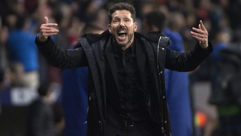 Atletico Madrid's Argentinian coach Diego Simeone calls on fans to encourage their team during the Spanish league football match between Club Atletico de Madrid and Athletic Club Bilbao at the Wanda Metropolitano stadium in Madrid on November 10, 2018. (Photo by CURTO DE LA TORRE / AFP)        (Photo credit should read CURTO DE LA TORRE/AFP/Getty Images)