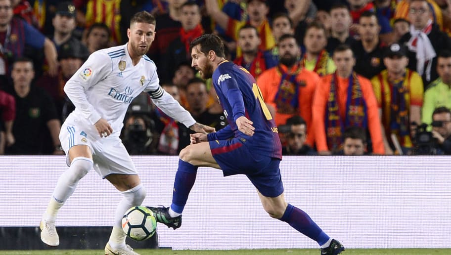 Barcelona's Argentinian forward Lionel Messi (R) vies with Real Madrid's Spanish defender Sergio Ramos during the Spanish league football match between FC Barcelona and Real Madrid CF at the Camp Nou stadium in Barcelona on May 6, 2018. (Photo by Josep LAGO / AFP)        (Photo credit should read JOSEP LAGO/AFP/Getty Images)