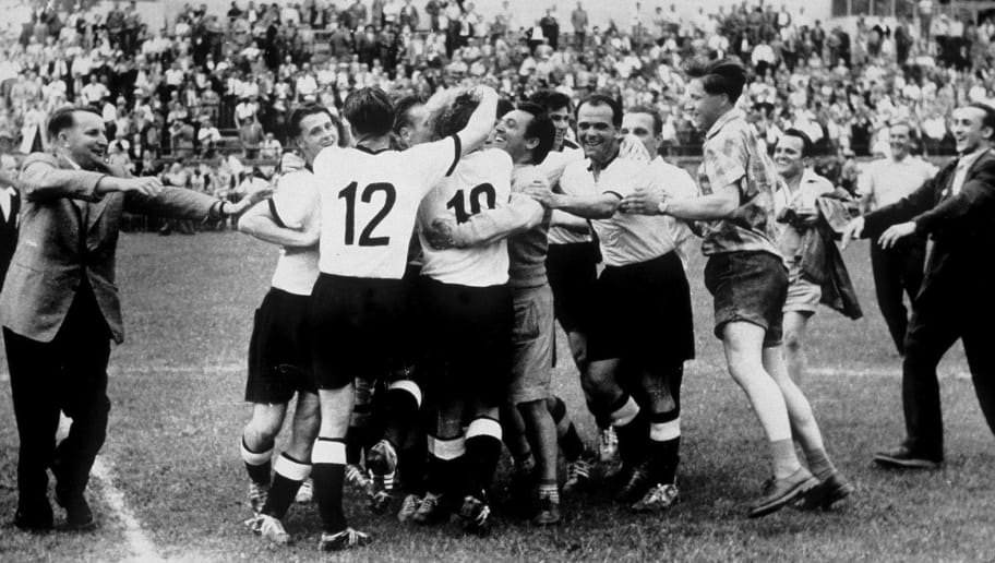 BERN, SWITZERLAND - JULY 4: The German Team celebrate after they won the FIFA World Cup 1954 final match between Hungary and Germany on July 4, 1954 in Bern, Switzerland. (Photo by Bongarts/Getty Images)