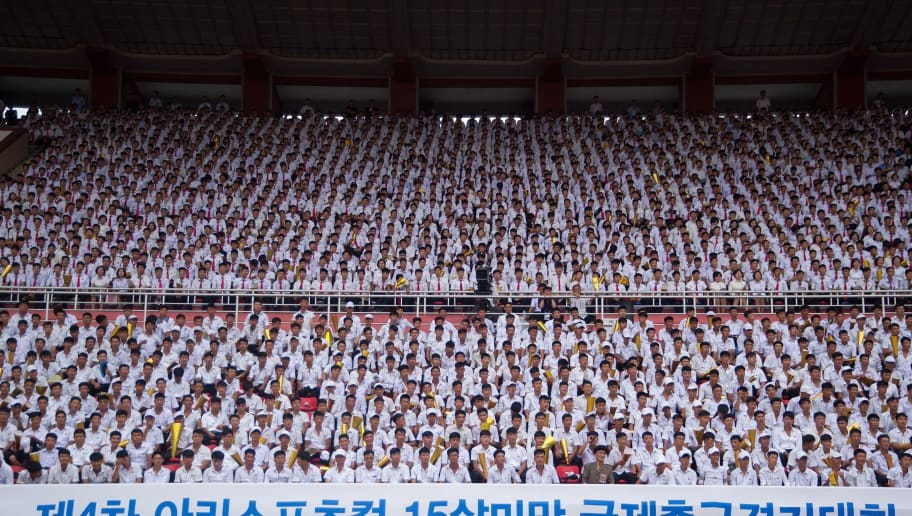 Students watch a men's football match between April 25 Sports Club of North Korea and the S Gangwon-do team of South Korea during the 4th Ari Sports Cup U-15 International Football Tournament at the Kim Il Sung Stadium in Pyongyang on August 15, 2018. - The tournament will end on August 18. (Photo by Kim Won-Jin / AFP)        (Photo credit should read KIM WON-JIN/AFP/Getty Images)