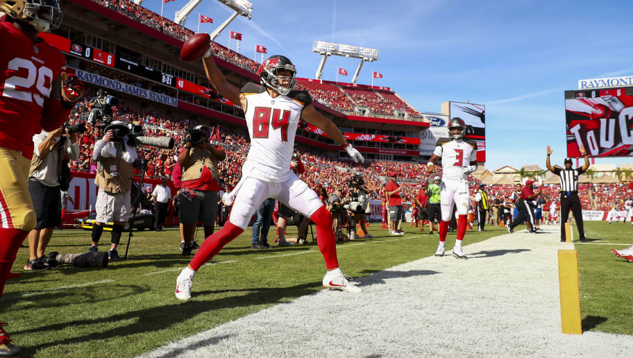 TAMPA, FL - NOVEMBER 25: Tight end Cameron Brate #84 of the Tampa Bay Buccaneers celebrates his touchdown in the first quarter of the game against the San Francisco 49ers at Raymond James Stadium on November 25, 2018 in Tampa, Florida. (Photo by Will Vragovic/Getty Images)