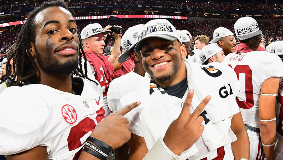 ATLANTA, GA - DECEMBER 01:  Tua Tagovailoa #13 of the Alabama Crimson Tide (R) reacts after defeating the Georgia Bulldogs 35-28 in the 2018 SEC Championship Game at Mercedes-Benz Stadium on December 1, 2018 in Atlanta, Georgia.  (Photo by Scott Cunningham/Getty Images)
