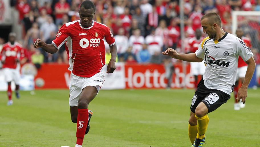 LIEGE, BELGIUM - AUGUST 07: Christian Benteke (L) of Standard Liege is challenged by Mijat Maric of KSC Lokeren OV during the Jupiler Belgian Pro League match between Standard Liege and KSC Lokeren OV held on August 7, 2011 at the Stade Maurice Dufrasne in Liege, Belgium. (Photo by Kristof Van Accom/EuroFootball/Getty Images)