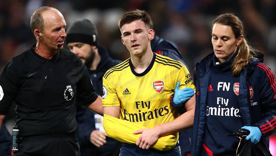 Julian Finney/GettyImages Kieran Tierney,Mike Dean
