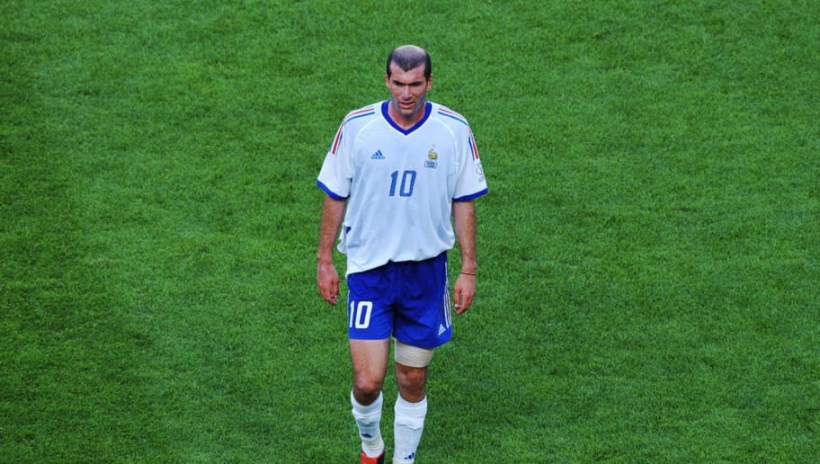 Zinedine Zidane of France, playing his first game of the tournament after  recovering from a thigh injury, walks off the pitch, 11 June 2002 at the Incheon Munhak Stadium in Incheon, following first round Group A action between Denmark and France in the 2002 FIFA World Cup Korea/Japan.  France crashed out of the tournament following a 2-0 defeat by Denmark.   AFP PHOTO/PASCAL GUYOT (Photo credit should read PASCAL GUYOT/AFP/Getty Images)