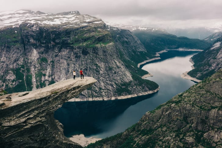 two people looking into a ravine
