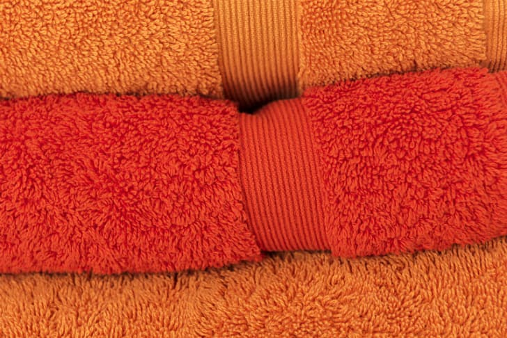 Bath towels are folded and stacked on top of one another