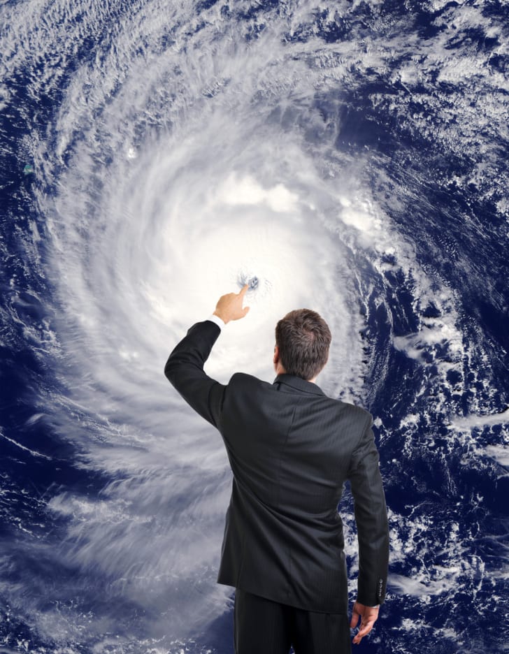 A meteorologist forecasting a hurricane