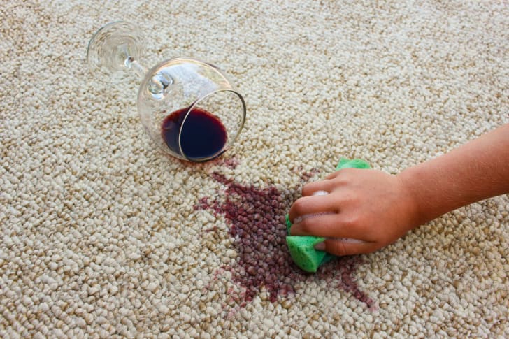 Cleaning spilled wine on a carpet
