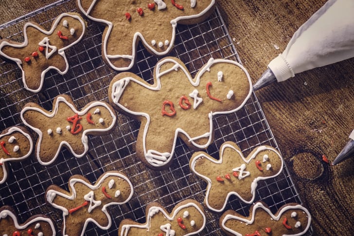A photo of gingerbread cookies being iced