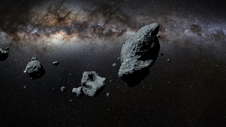 an artists rendering of the asteroid belt.
