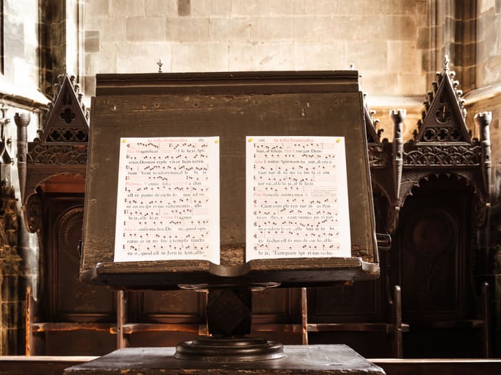 Antique sheet music set up on a church lectern