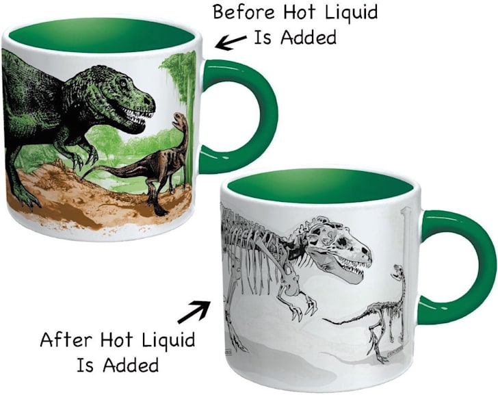Before and after shots of heat-sensitive disappearing dinosaur mug.