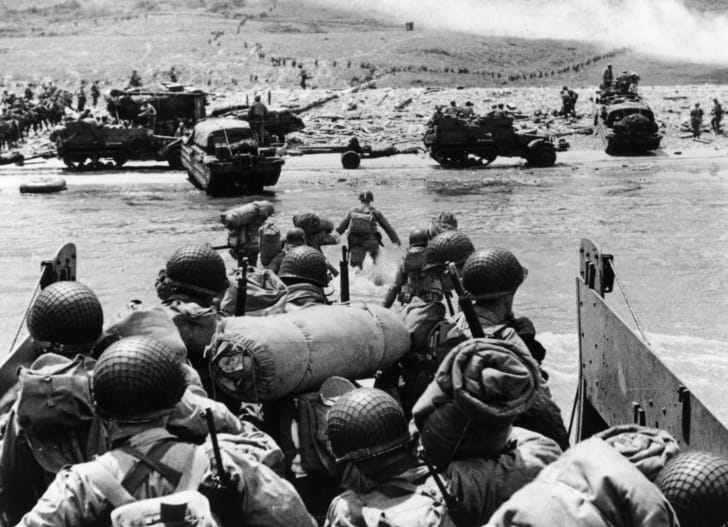 American assault troops and equipment landing on Omaha beach on the Northern coast of France.