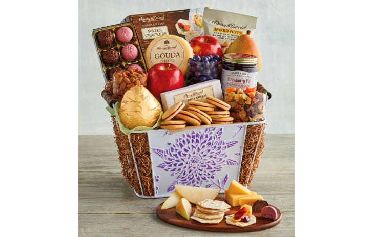 A Mother's Day gift basket filled with cheese, cookies, and more