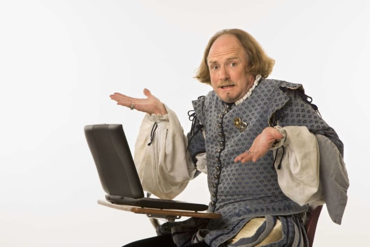 shakespeare impersonator at a laptop