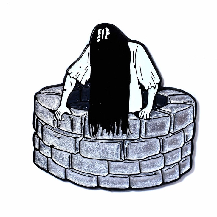Samara enamel pin.