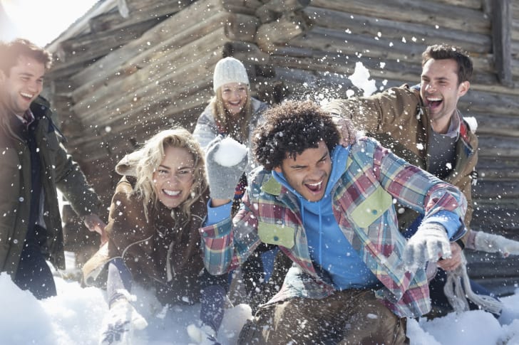 Kids having a snowball fight.