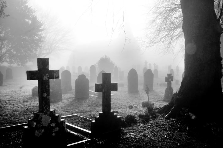 A photo of a foggy graveyard.
