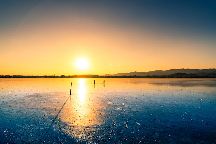 Sunset over a frozen lake
