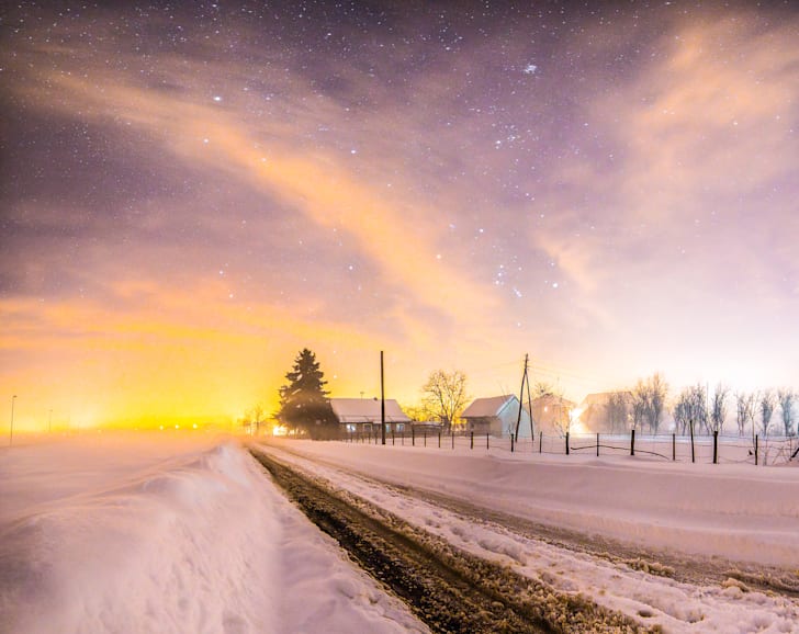 Sunset over a snowy field