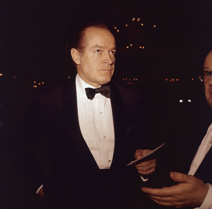 October 1961: American movie icon Bob Hope (1903 - 2003) arrives at a social function wearing a jacket and bow tie