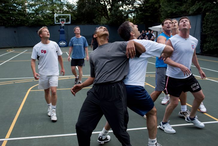 Obama playing basketball with his staff.
