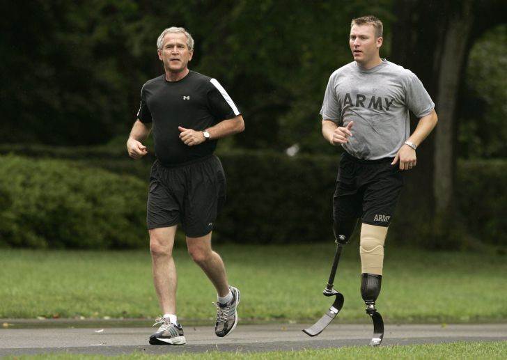 George W. Bush goes jogging with an injured army veteran.