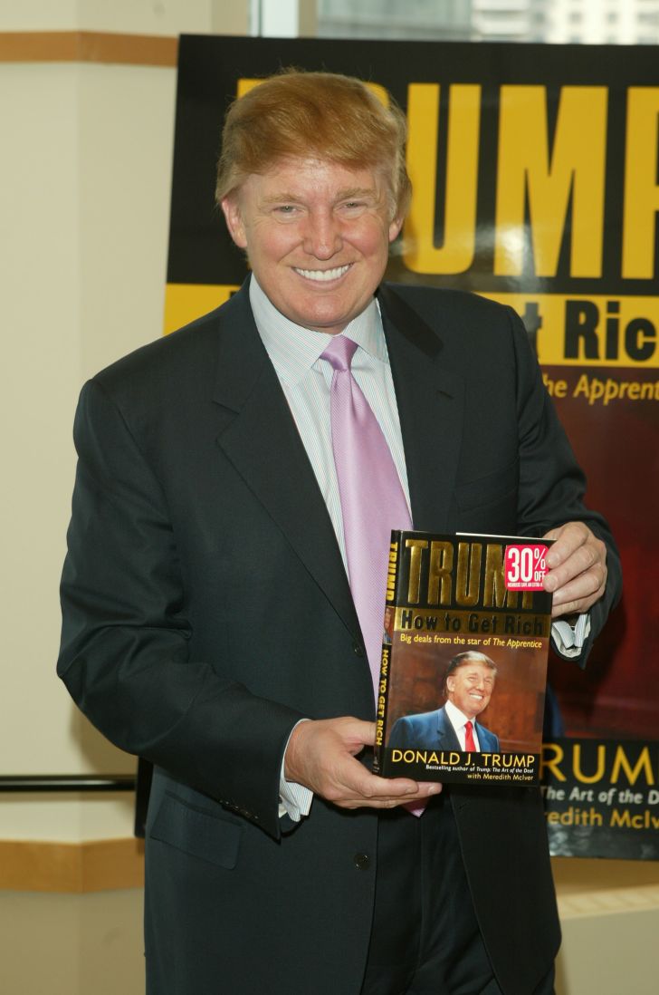 Donald Trump with a book.