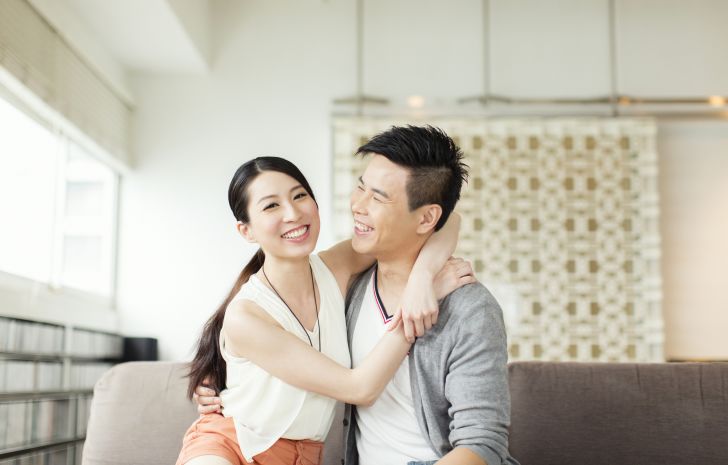 Young Asian couple smiling