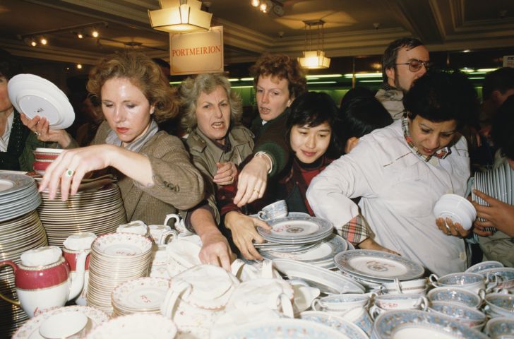 Customers jostle to get the best crockery bargains on the first day of the Harrod's sale in 1988.