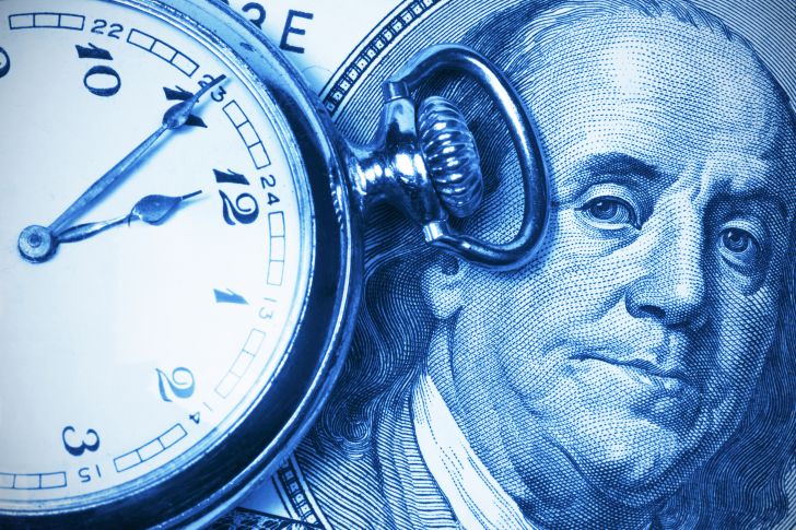 A pocketwatch and picture of Benjamin Franklin