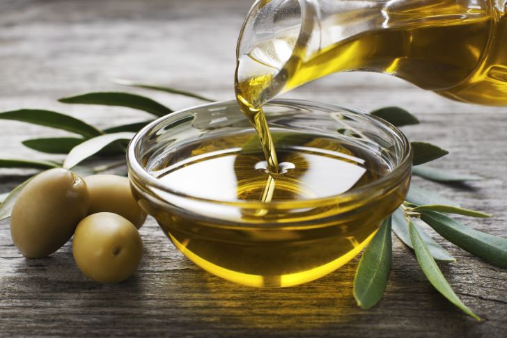Olive oil in a glass bowl.