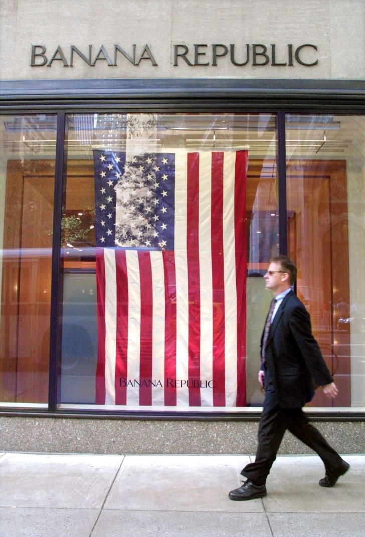 American flag hanging in the window of a Banana Republic