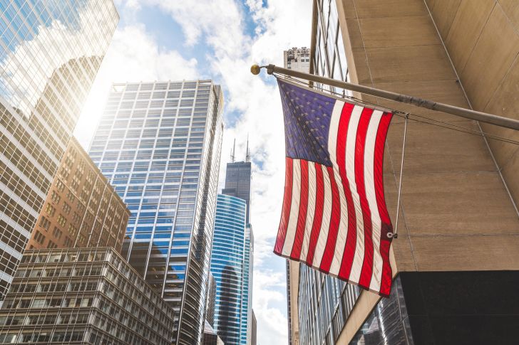 American flag on city street