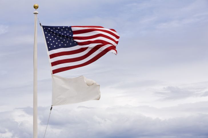 American flag over white flag