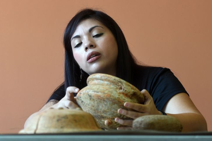 archaeologist with ancient pottery