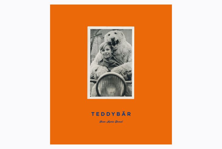 The orange cover of 'Teddybär' shows a person in a polar bear suit with his arms wrapped around a smiling boy.