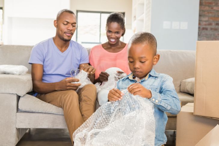 Child popping Bubble Wrap.