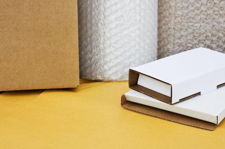 Rolls of bubble wrap and shipping boxes.